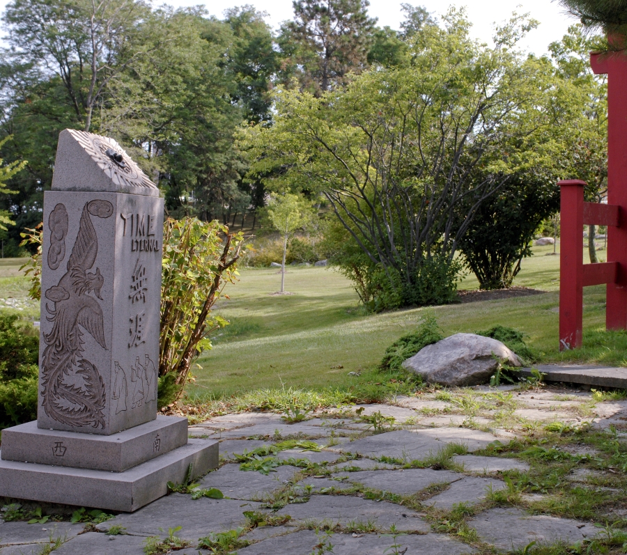 sundial at Beechwood with gate in the background