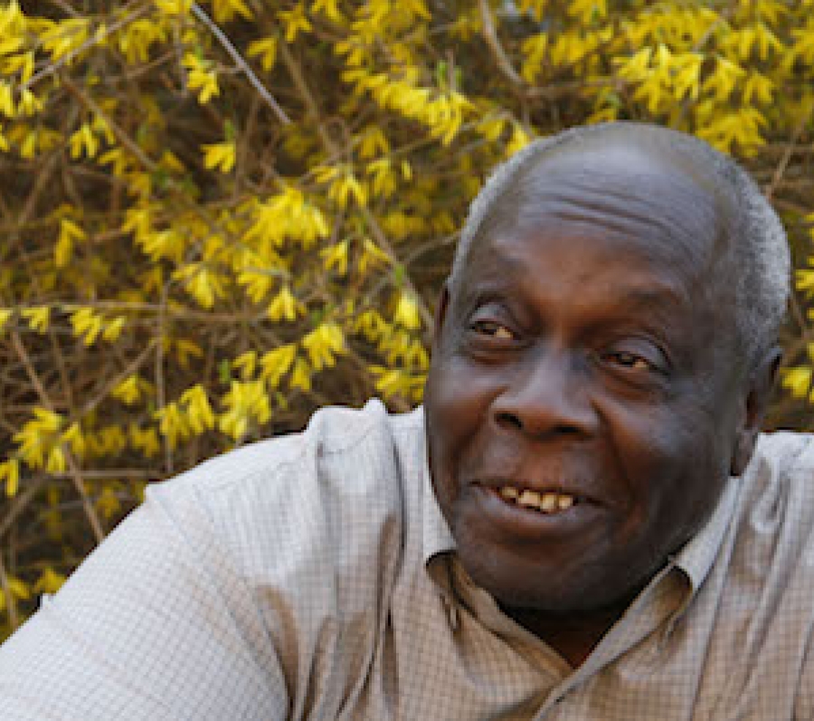 older black man in a grey shirt