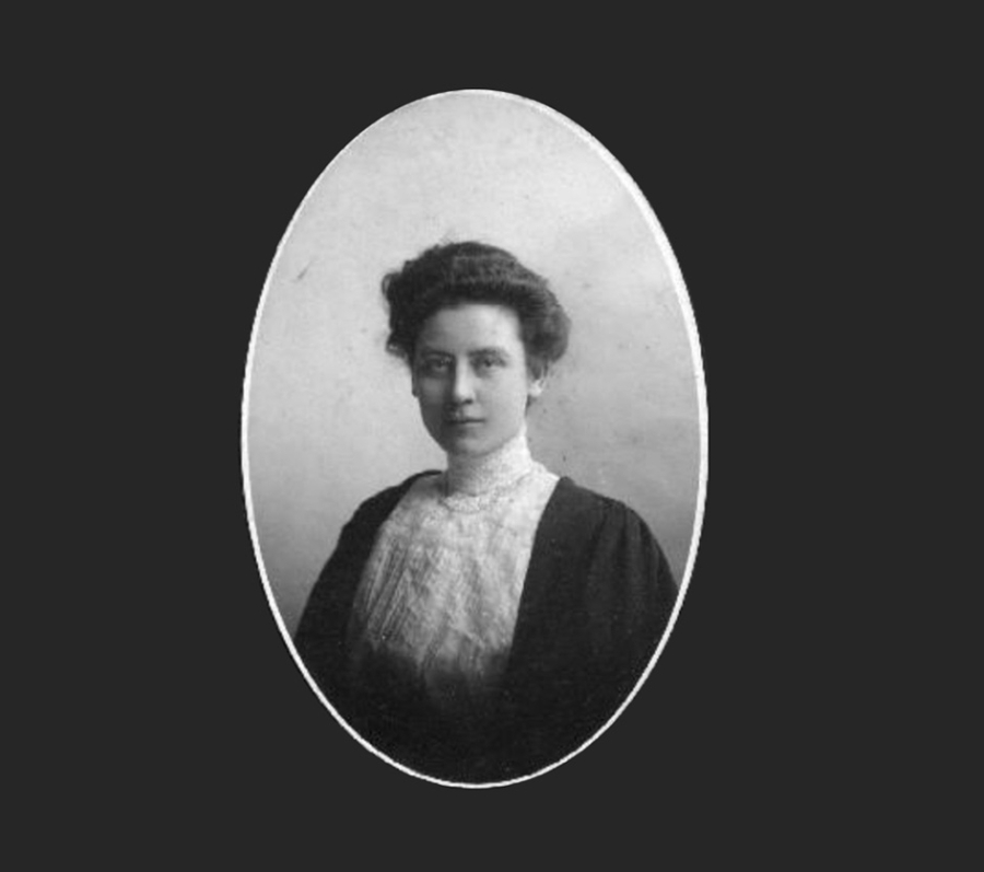 A vintage black‑and‑white portrait of Jennie Smilie Robertson shown from the waist up, wearing a high‑collared lace blouse and a dark jacket, framed within an oval border against a plain background.
