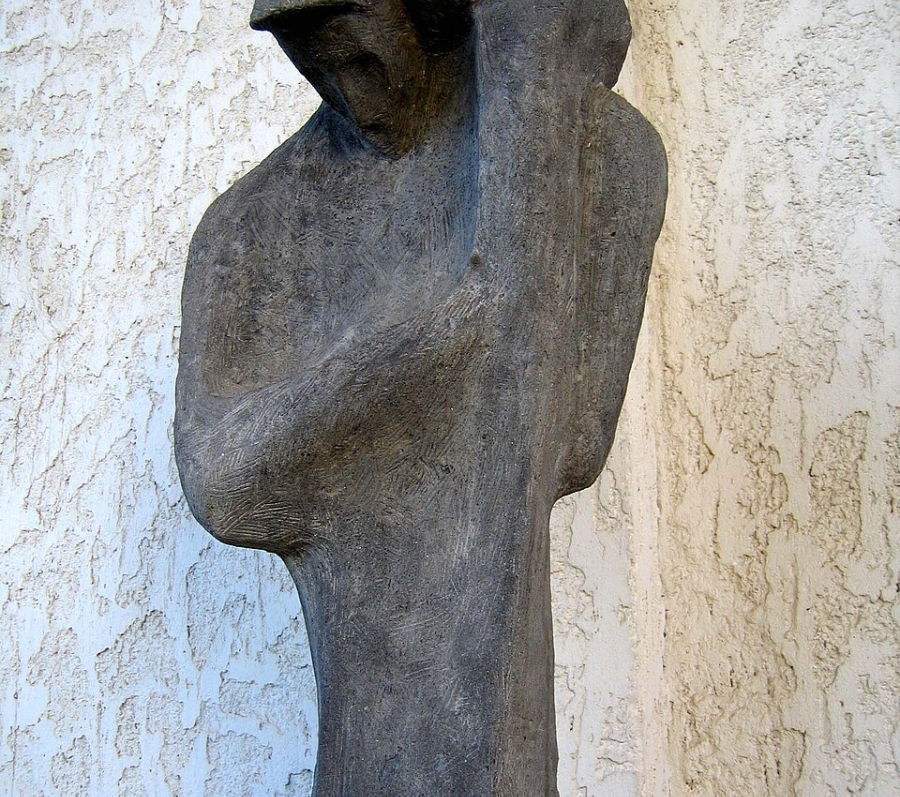 figure of man holding a child