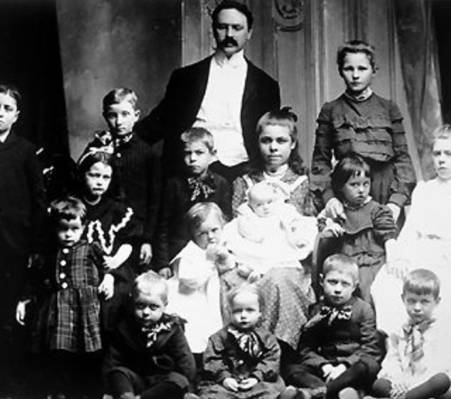 a man and a woman with a group of children