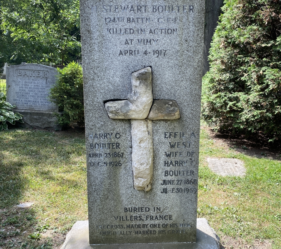 stone and granite monument with a cross