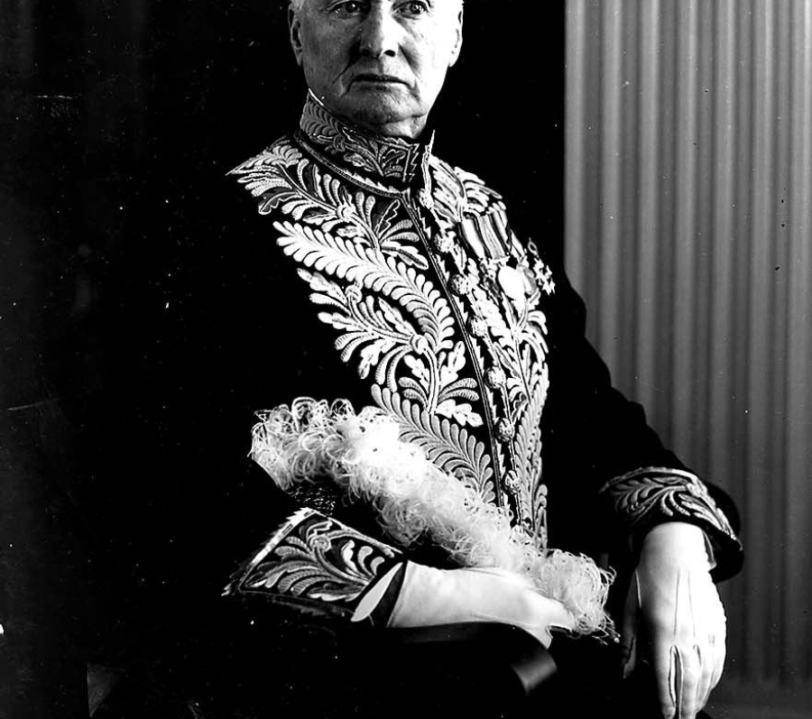 grey hair unsmiling man