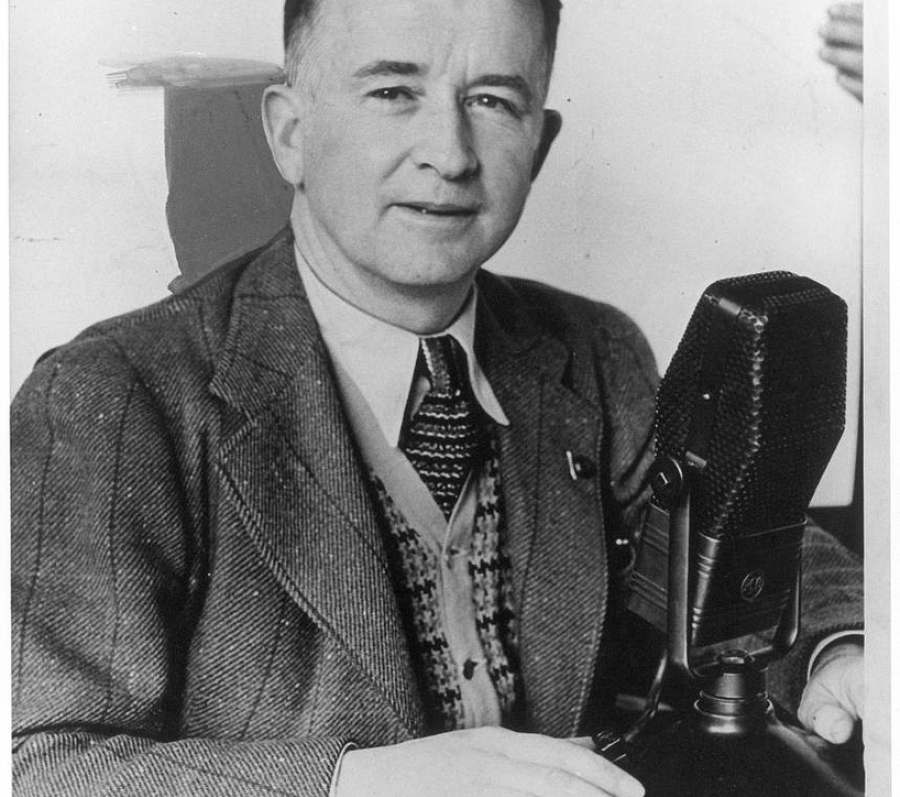 man in a suit with a microphone