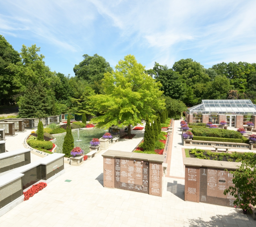 building, trees and a pond