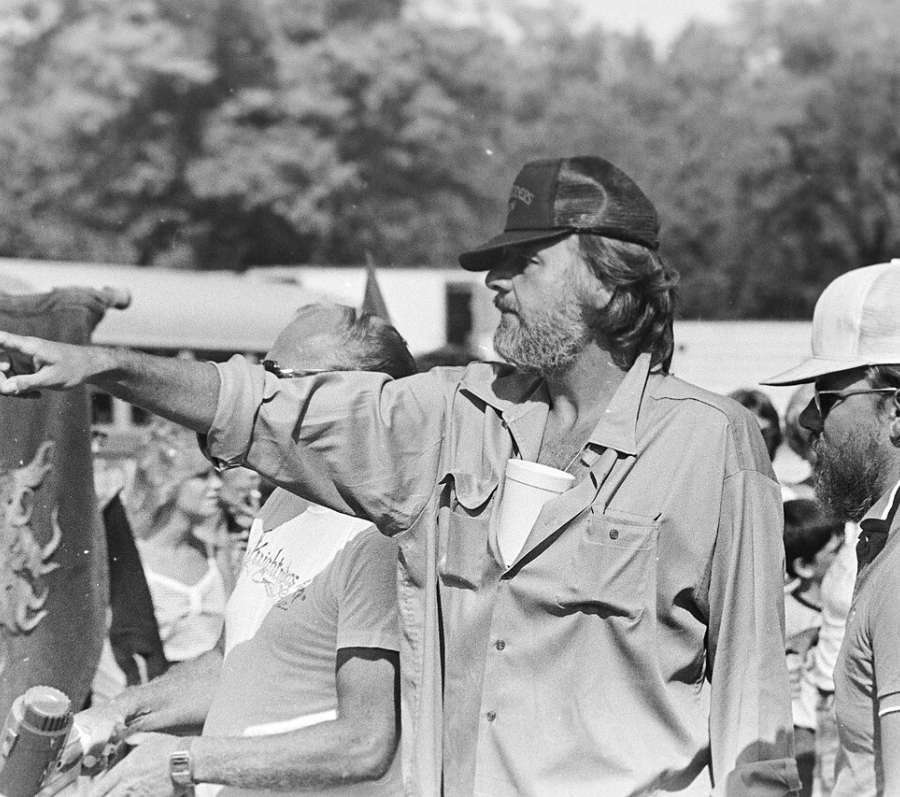 man with a hat directing a movie
