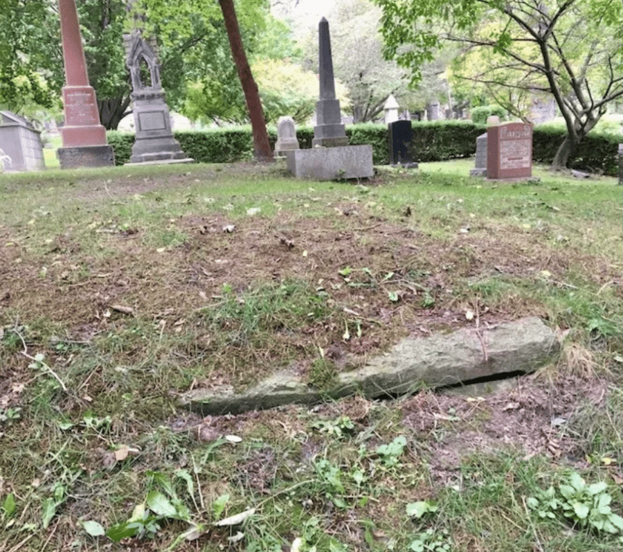 grave peeking out of the ground