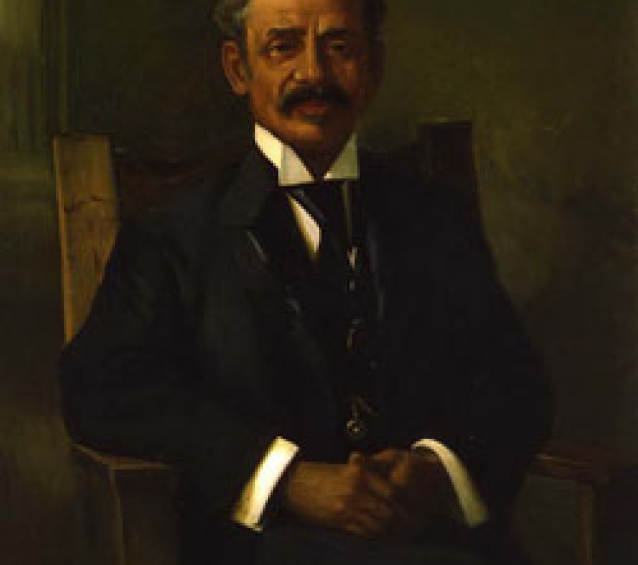 black man with a mustache in a suit