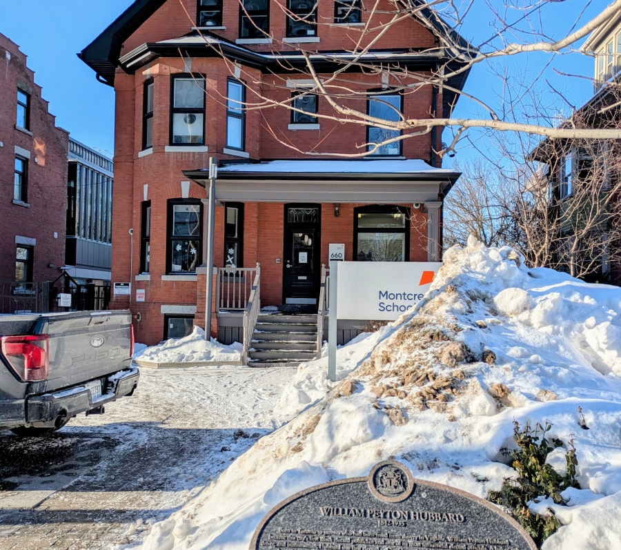 a big house with blue sky and snow