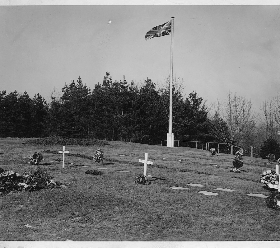 hill with crosses and a pole with the Canadian flag