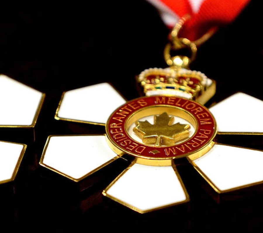 three medals shaped like flowers