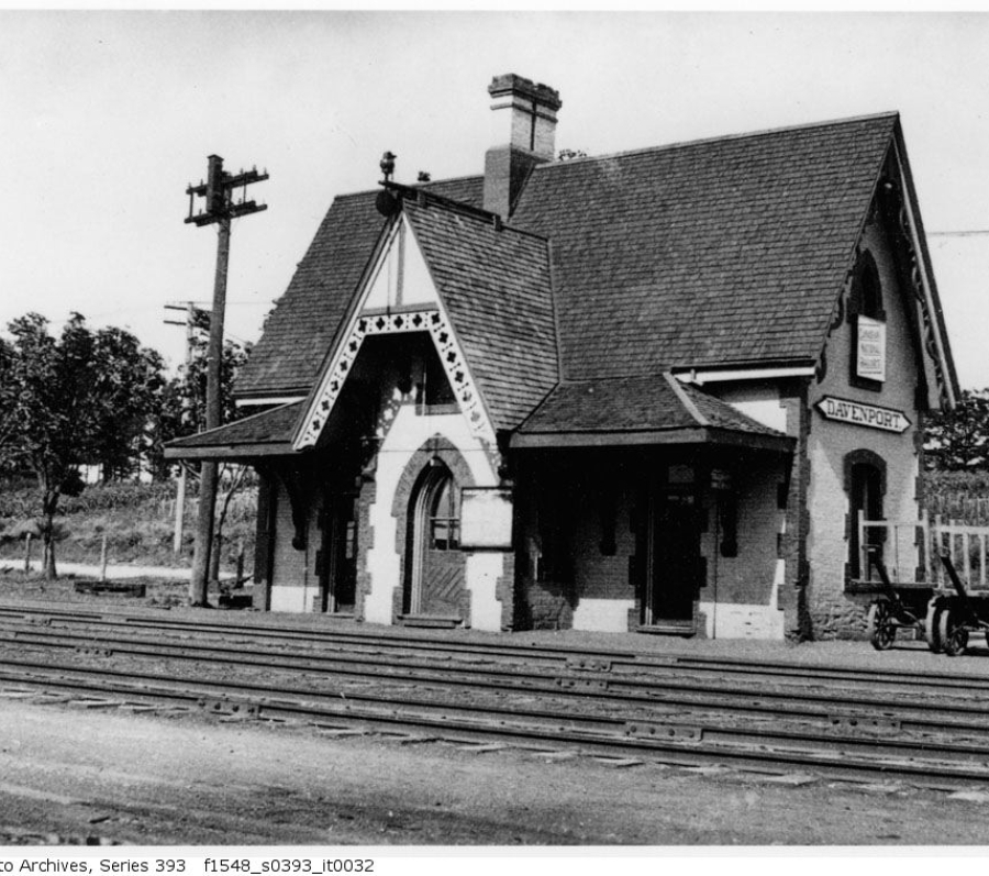 big brick house by train tracks