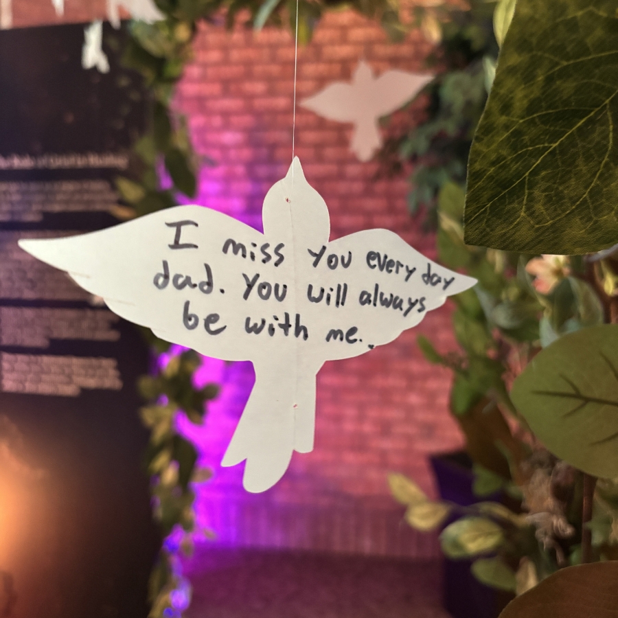 White dove note reading “I miss you every day dad.”