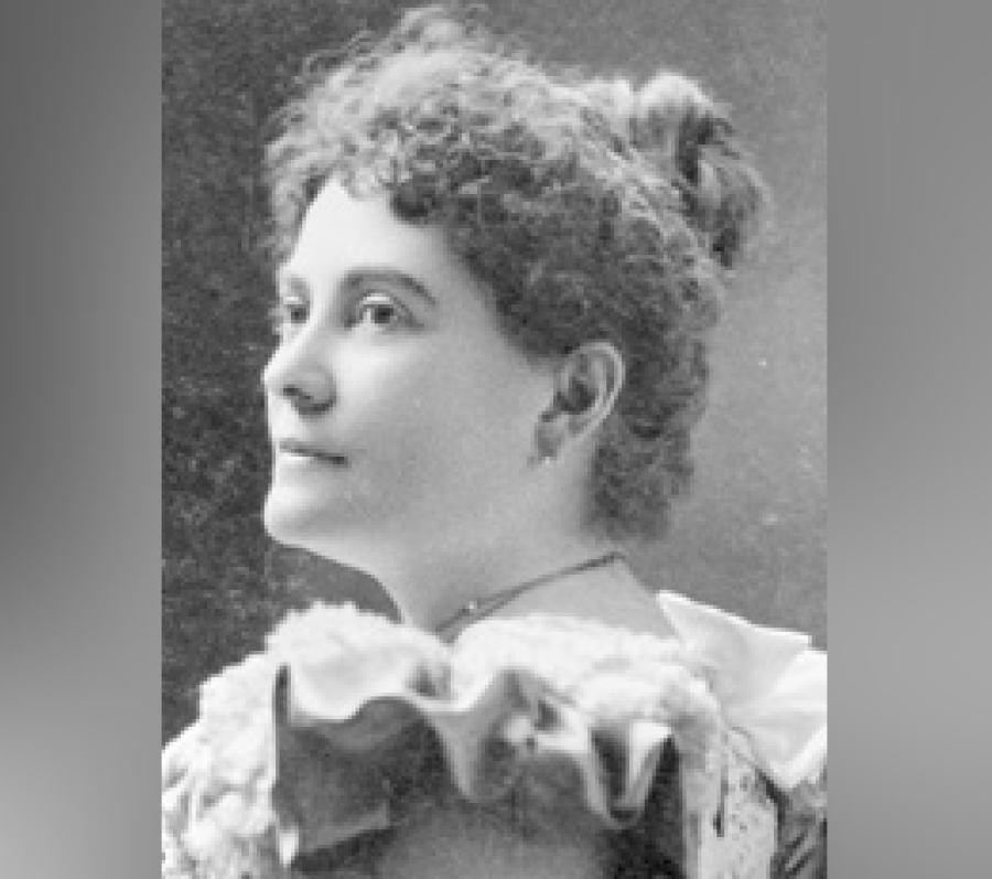 Black‑and‑white archival portrait of Augusta Stowe Gullen shown in profile, wearing a high‑collared Victorian‑era dress with decorative detailing at the neckline, her hair styled up, against a plain studio background.