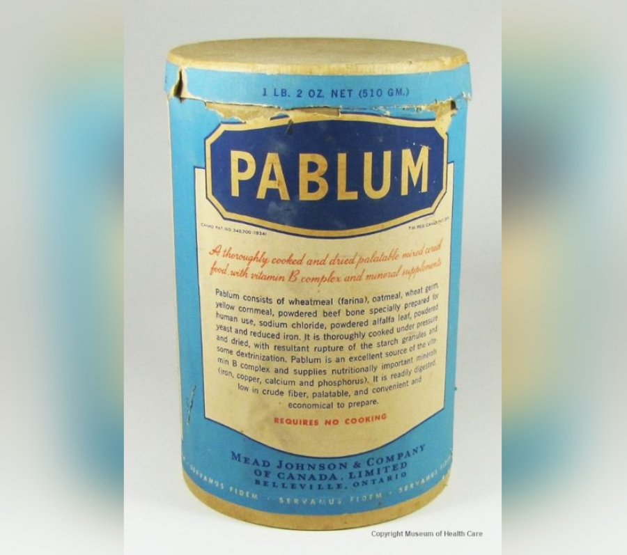 Vintage cylindrical tin of Pablum infant cereal with a blue label and gold lettering, showing detailed product information and nutritional claims, photographed against a plain background.