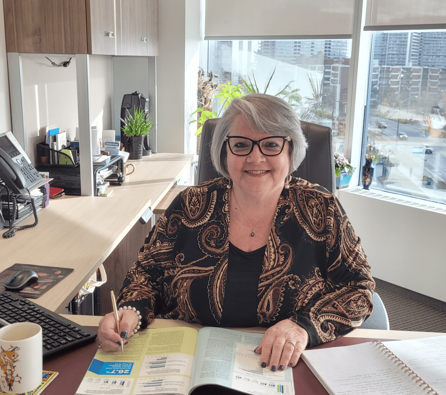 Angie Aquino at her desk