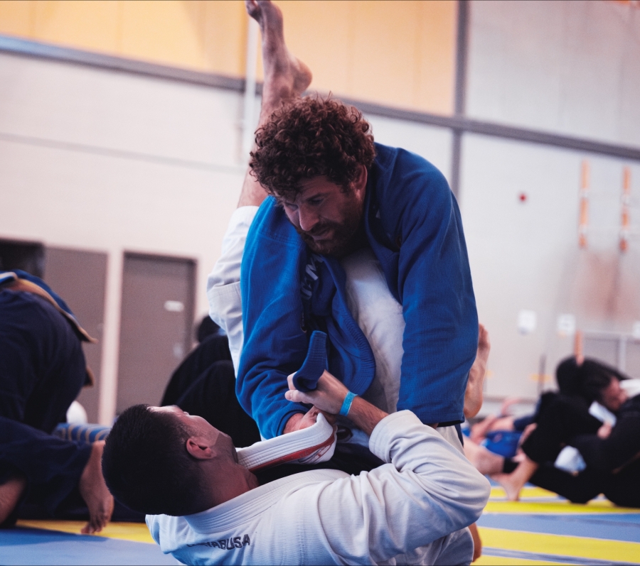 Brazilian Jiu Jitsu practitioners demonstrating a grappling technique.