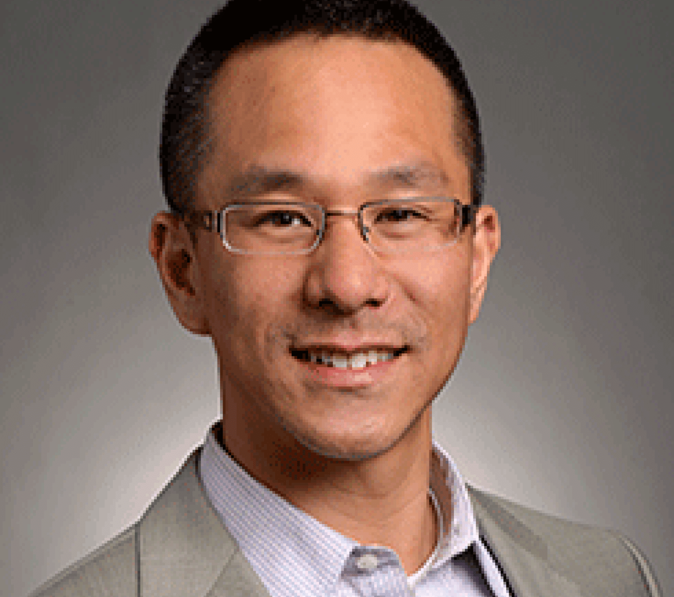 smiling asian man with glasses