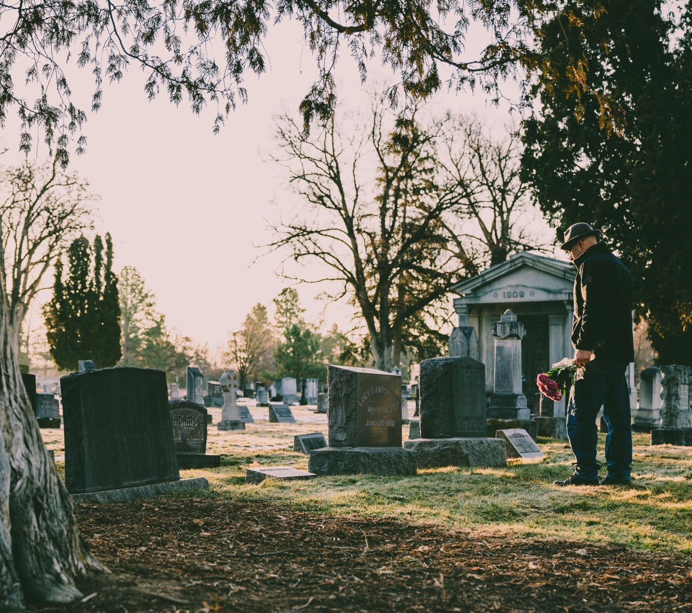 a man standing before the tomb