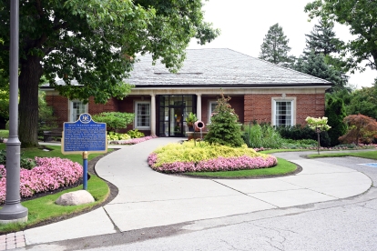 office building with flowers and trees