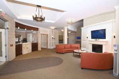 reception area with couches and a tv