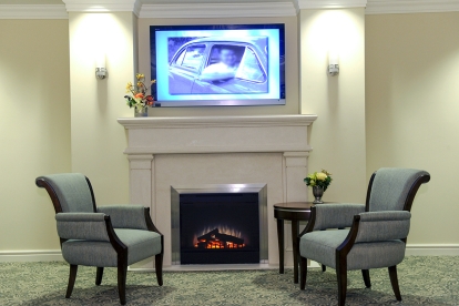 chairs, fireplace and TV screen at TSA Pickering