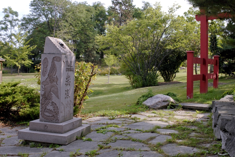 sundial at Beechwood with gate in the background