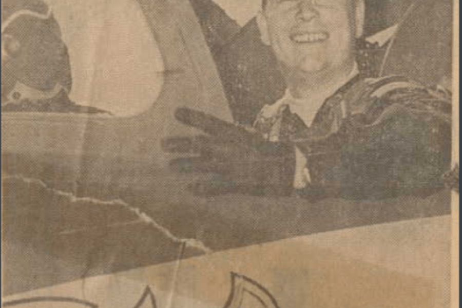 newspaper clipping of man in an airplane