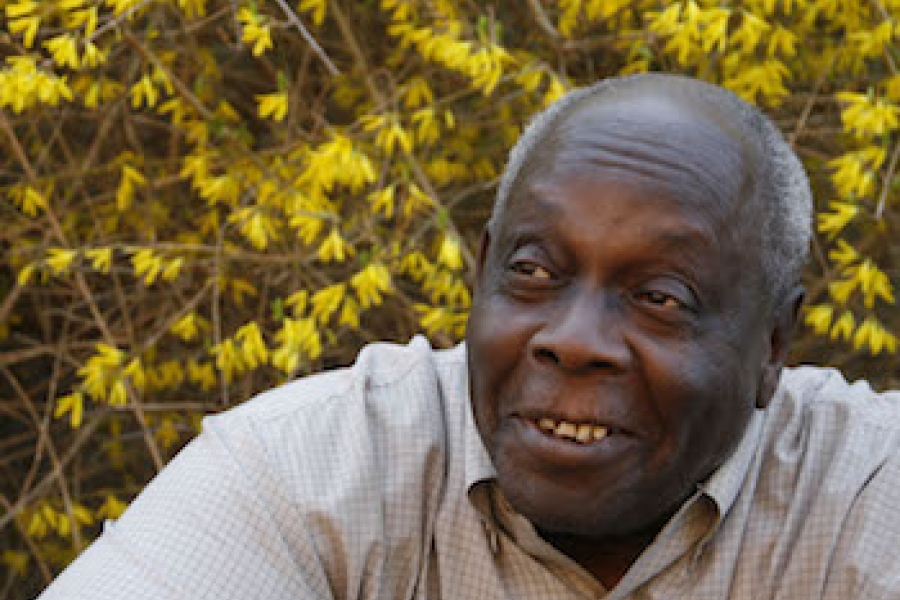 older black man in a grey shirt
