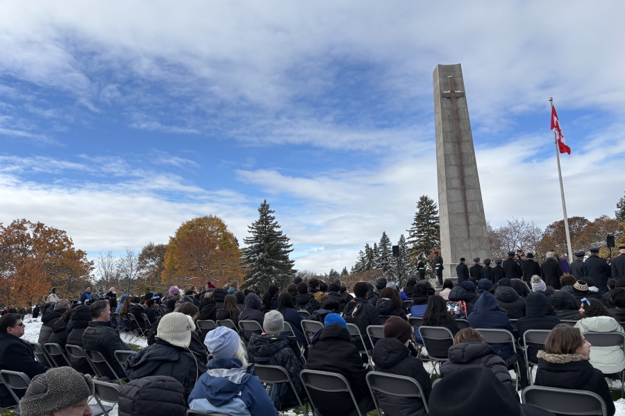 people sitting down for a Remembrance Day service