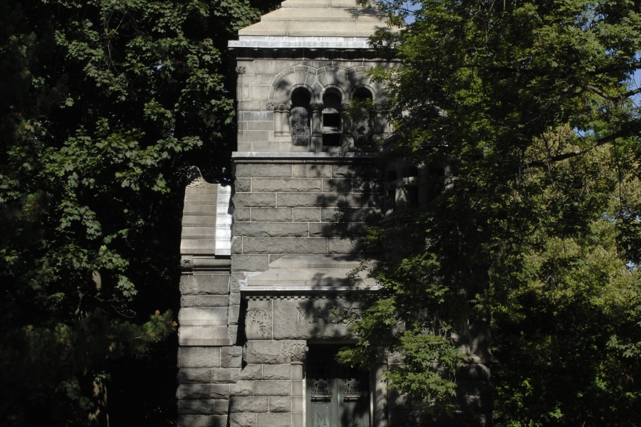 tall brick structure with steps surrounded by trees