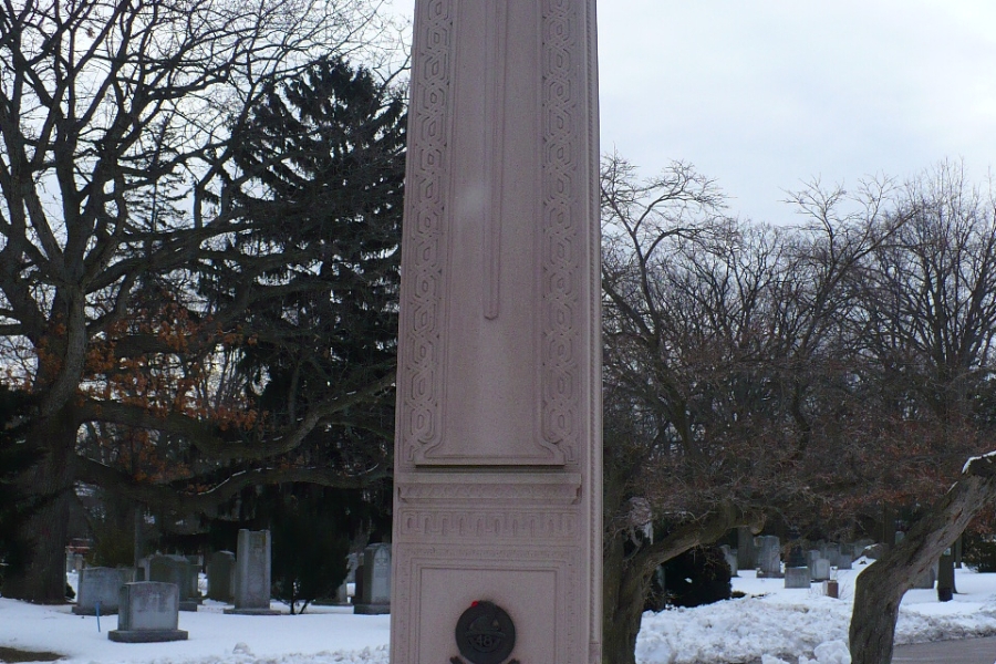tall memorial monument with wreaths