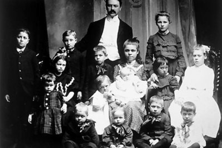a man and a woman with a group of children