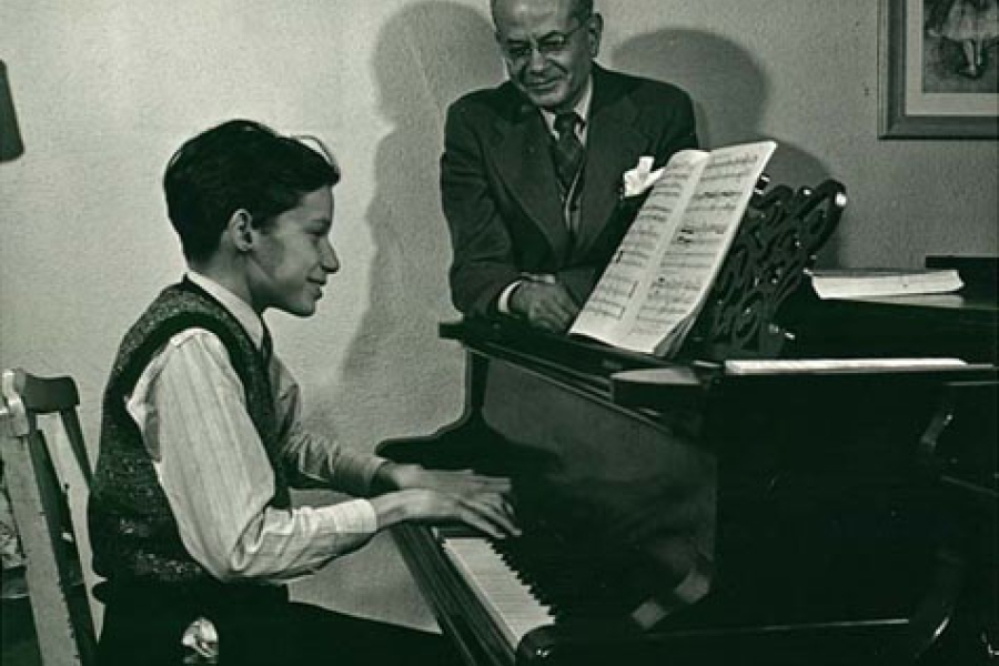 young boy at a piano
