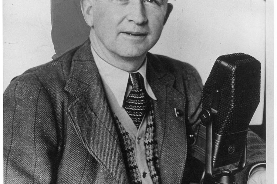 man in a suit with a microphone