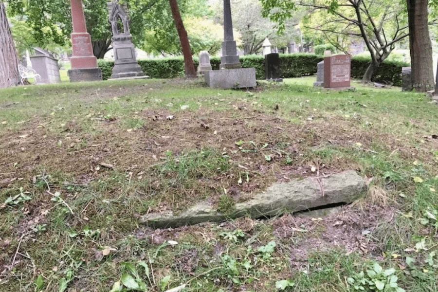 grave peeking out of the ground