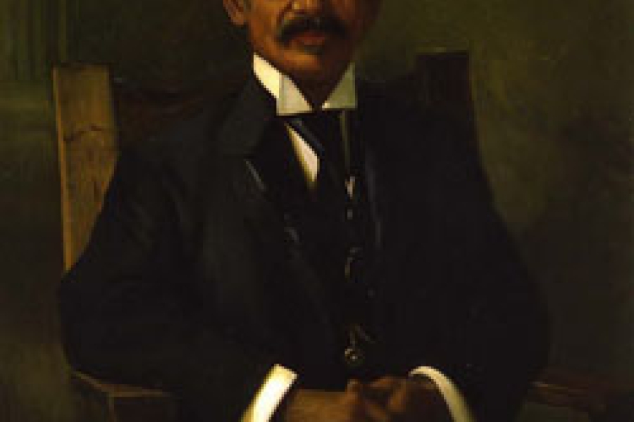 black man with a mustache in a suit
