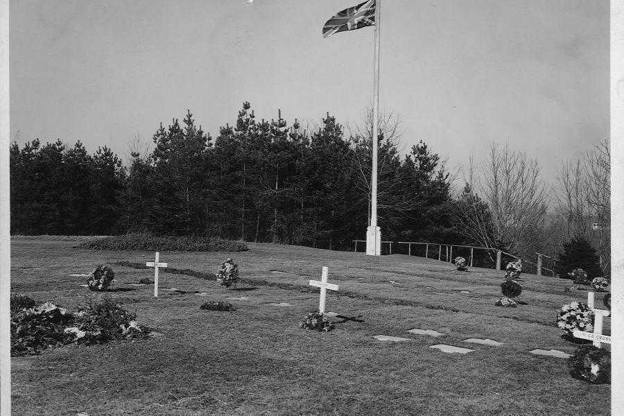 hill with crosses and a pole with the Canadian flag