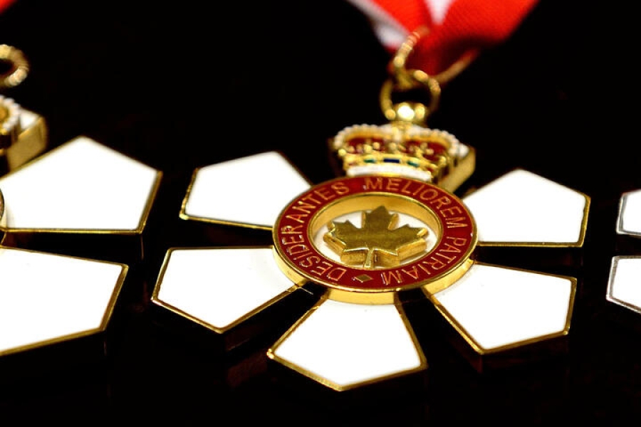 three medals shaped like flowers