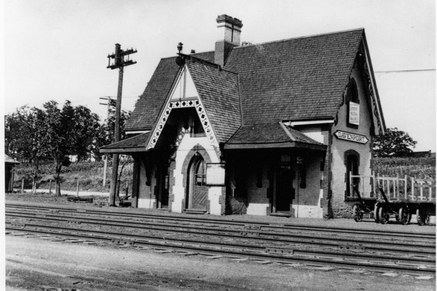 big brick house by train tracks