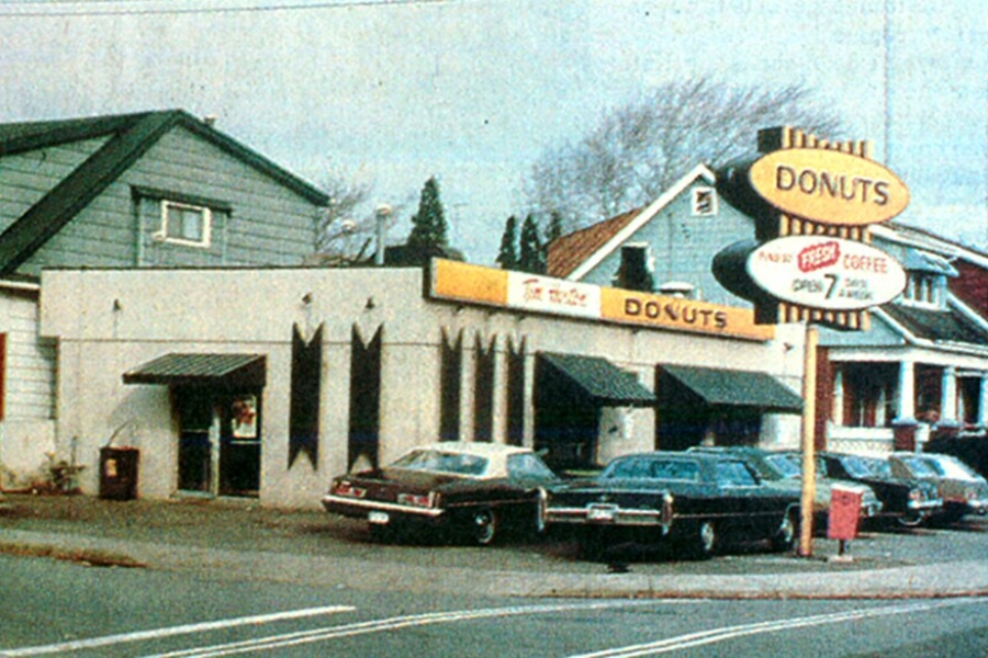 building with a donut sign out front