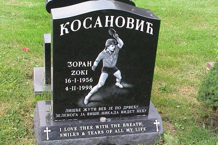 gravestone with a table tennis player on it